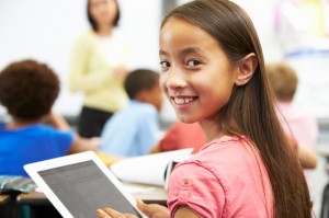 Pupil In Class Using Digital Tablet