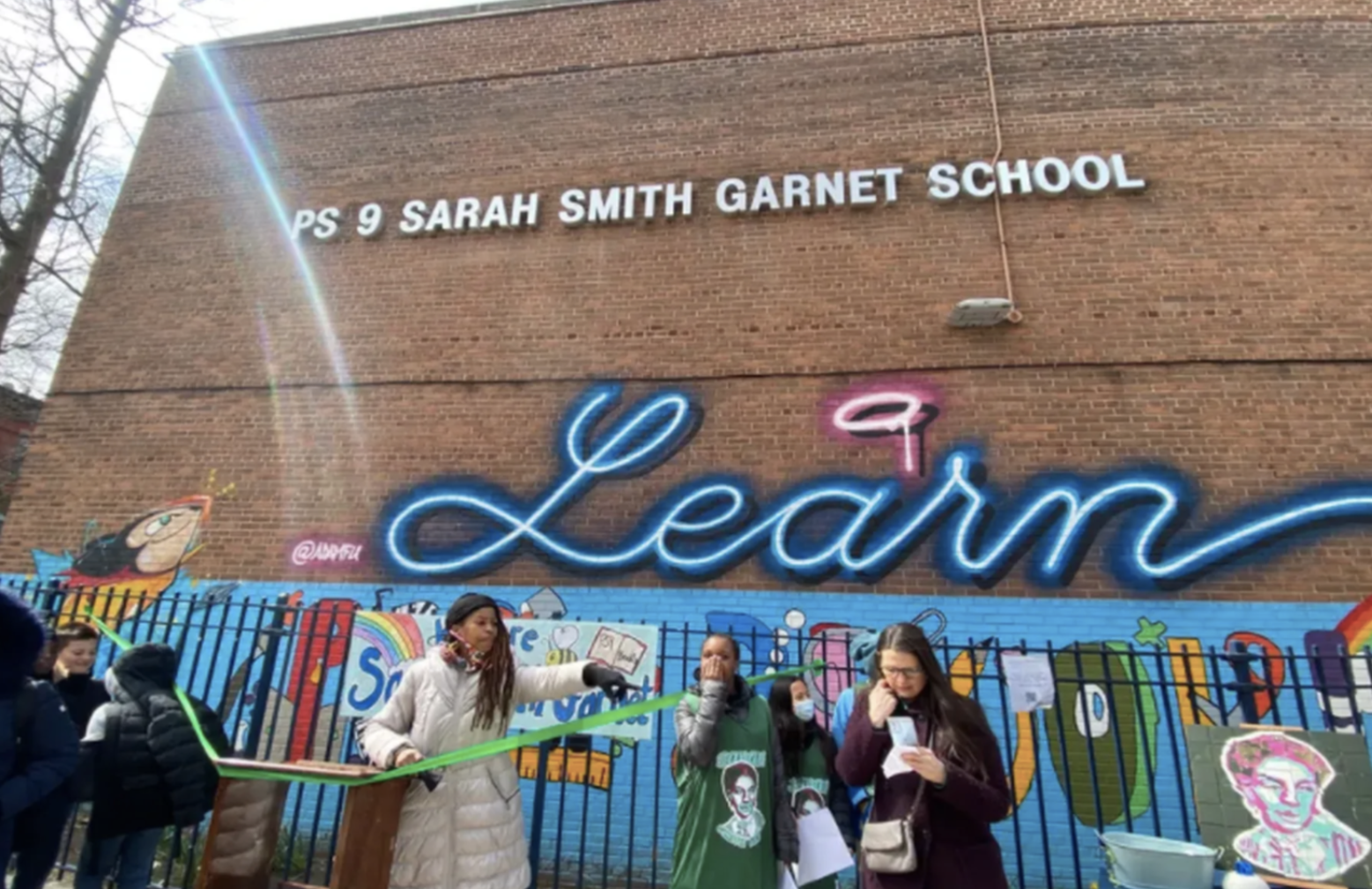 Brooklyn school unveils sign honoring suffragist, displacing name synonymous with slavery