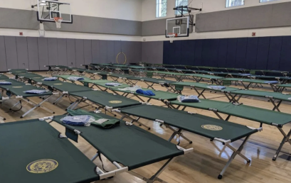 Seven school gyms are housing migrants or could soon. Parents and pols are pushing back.