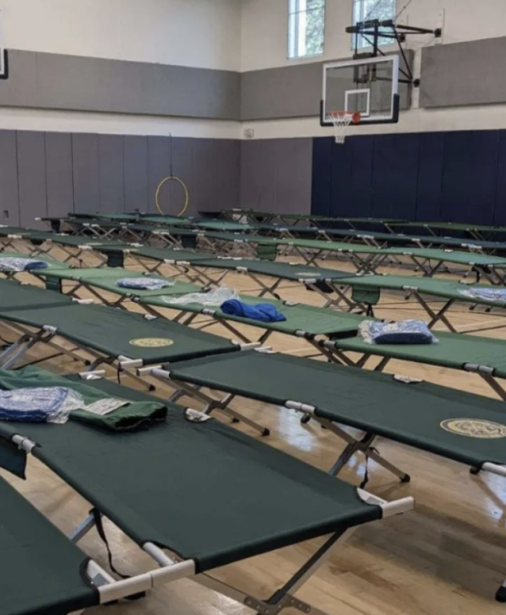 Seven school gyms are housing migrants or could soon. Parents and pols are pushing back.