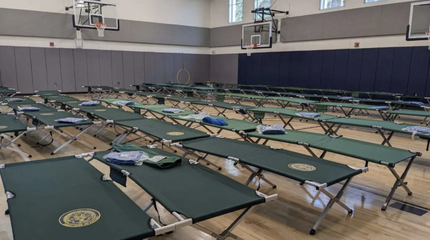 Seven school gyms are housing migrants or could soon. Parents and pols are pushing back. Seven school gyms are housing migrants or could soon. Parents and pols are pushing back.