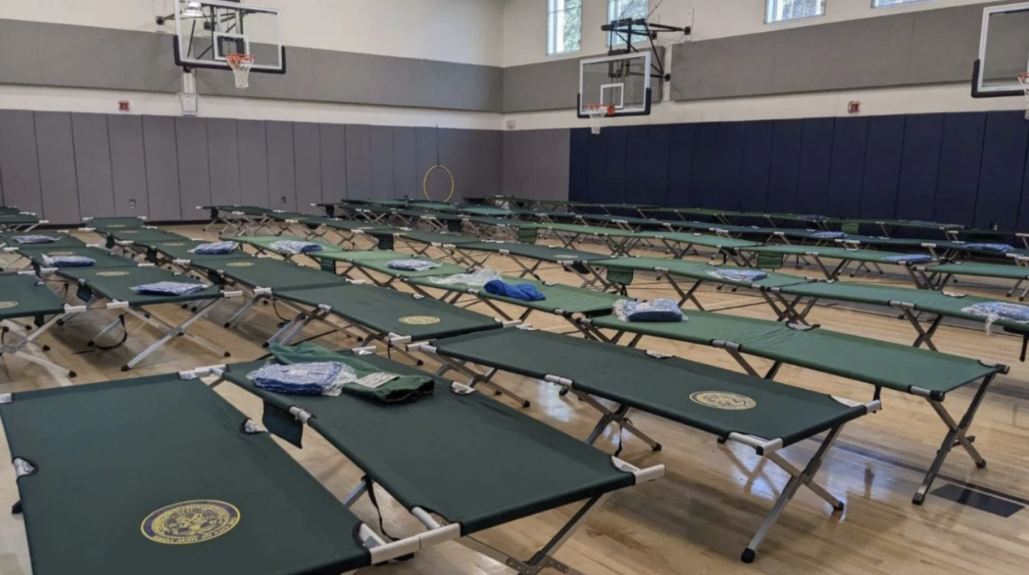 Seven school gyms are housing migrants or could soon. Parents and pols are pushing back.