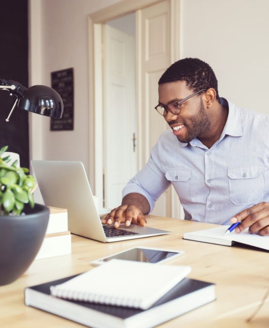 Afro american young man in a home office