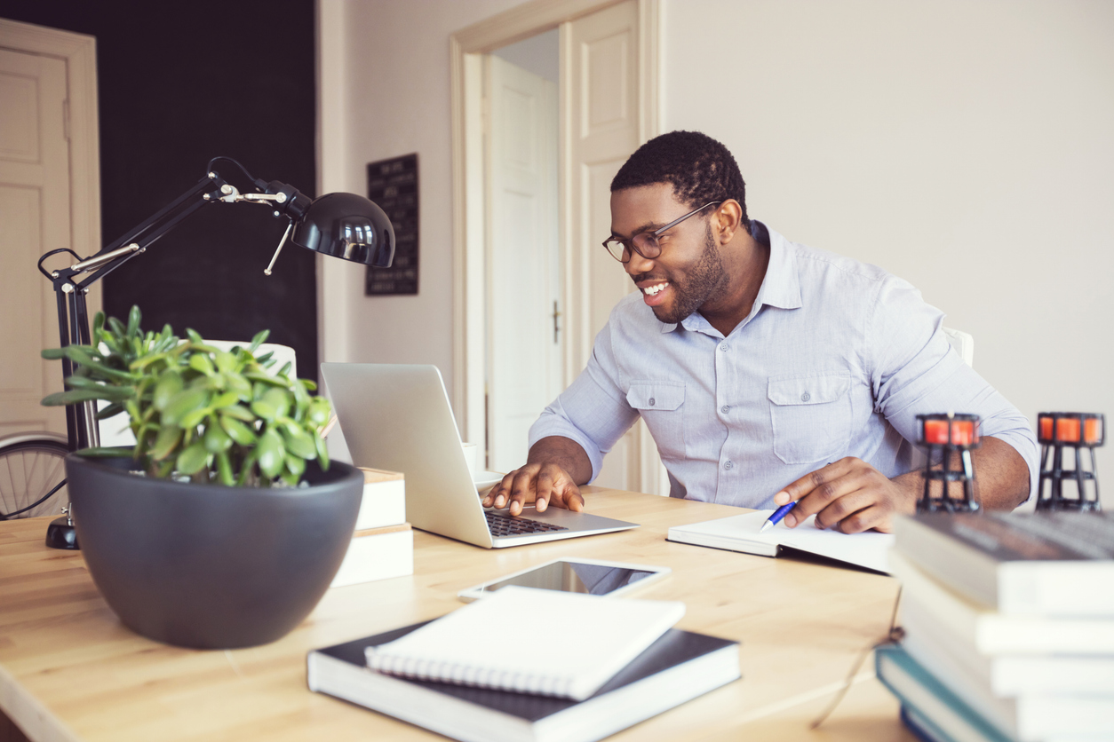 Afro american young man in a home office
