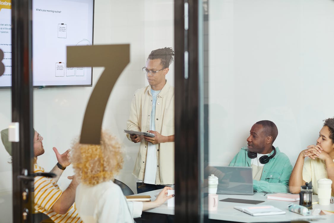 A diverse team of school leaders collaborates in a modern conference room