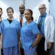 A diverse team of nurse practitioners collaborating in a clinical setting