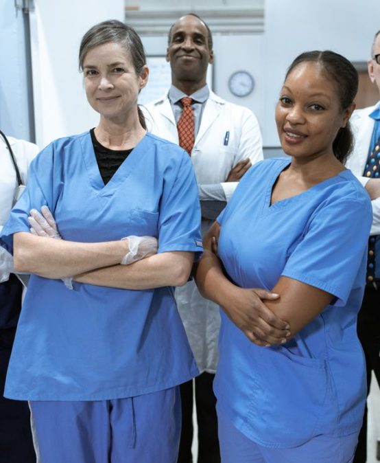 Diverse nurse practitioner and physician care team in a hospital
