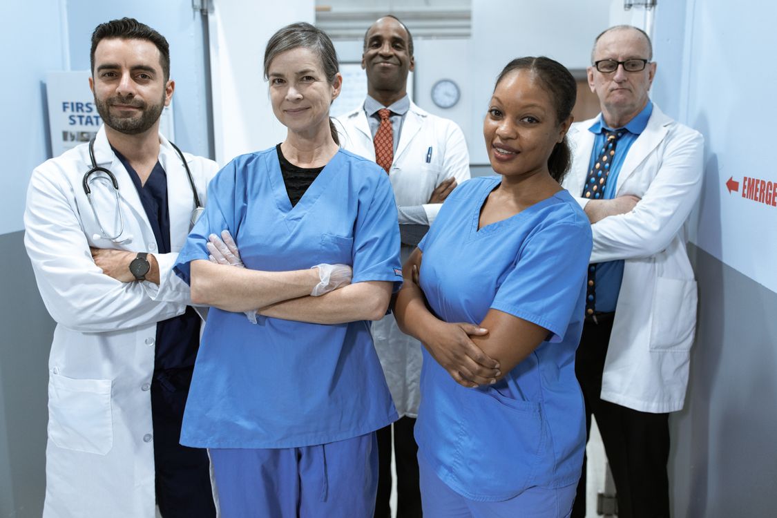 Diverse nurse practitioner and physician care team in a hospital