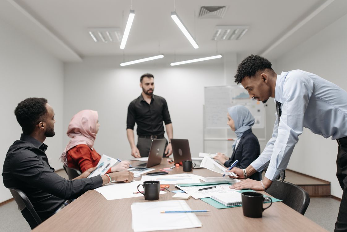 Diverse school leaders planning around a conference table