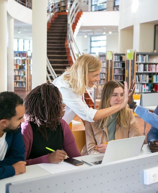 Multiracial group of teachers collaborating during graduate coursework