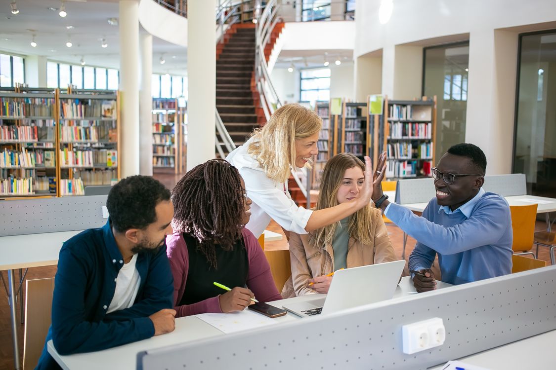 Multiracial group of teachers collaborating during graduate coursework