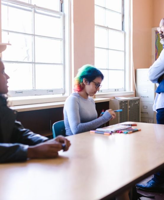 Diverse teachers collaborating in a classroom