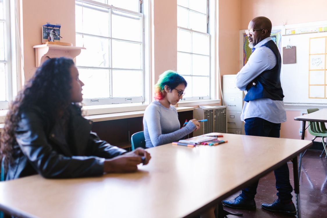 Diverse teachers collaborating in a classroom